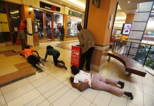 People trying to scramble to safety as police engage the gunmen. Source: Goran Tomasevic / Reuters