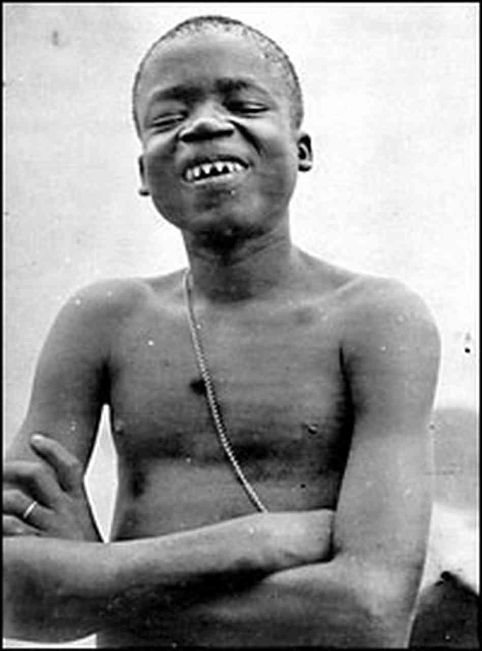 Ota Benga (circa 1883 – March 20, 1916) was a Congolese man, an Mbuti pygmy known for being featured in an anthropology exhibit at the Louisiana Purchase Exposition in St. Louis, Missouri in 1904, and in a controversial human zoo exhibit in 1906 at the Bronx Zoo. Benga had been freed from African slave traders by the missionary Samuel Phillips Verner, a businessman recruiting Africans for the Exposition. He traveled with Verner to the United States. At the Bronx Zoo, Benga had free run of the grounds before and after he was "exhibited" in the zoo's Monkey House. [Image and description courtesy of Wikipedia]